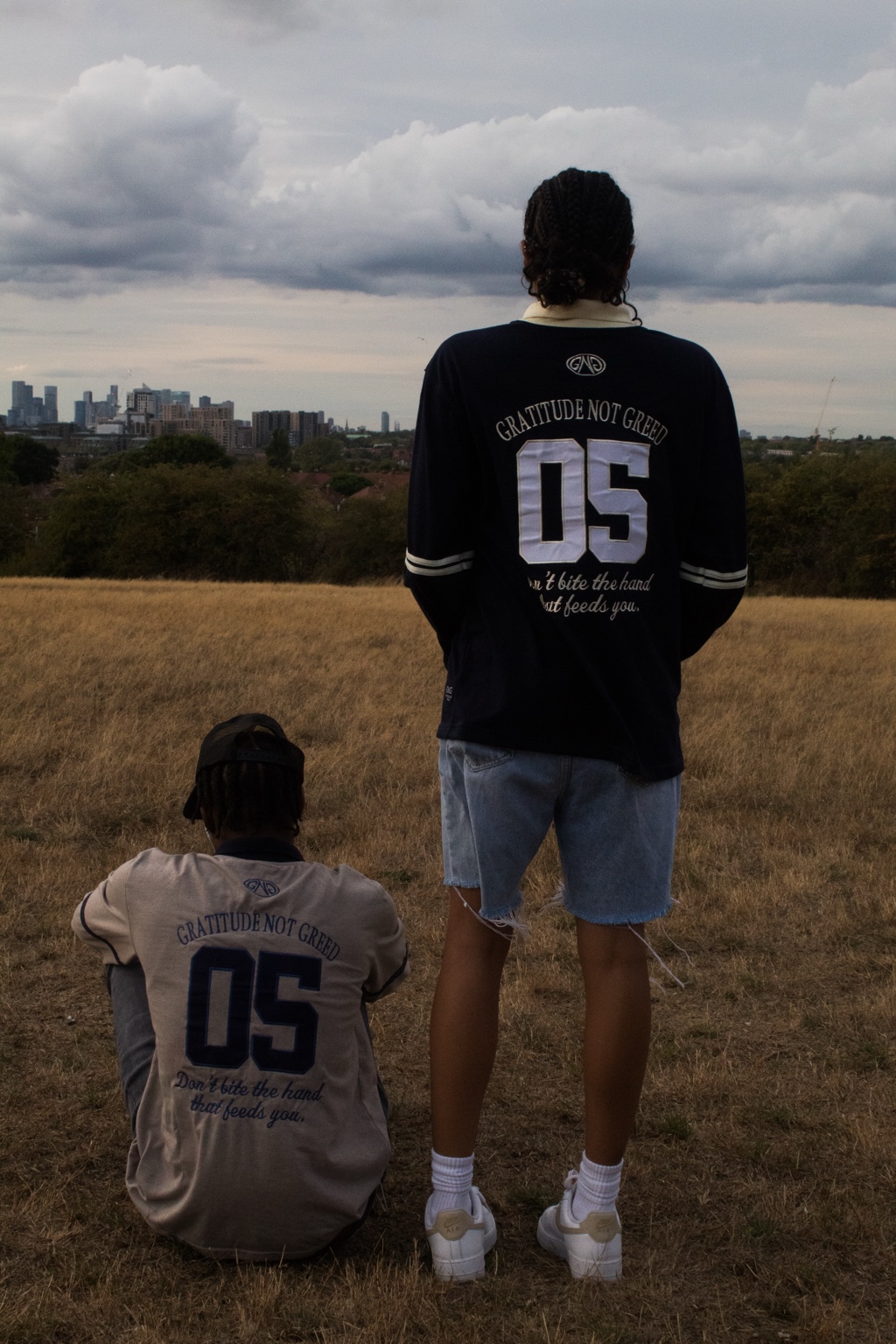 GNG campaign — 05 embroidery on the backs of the navy and grey rugby polos, London skyline behind